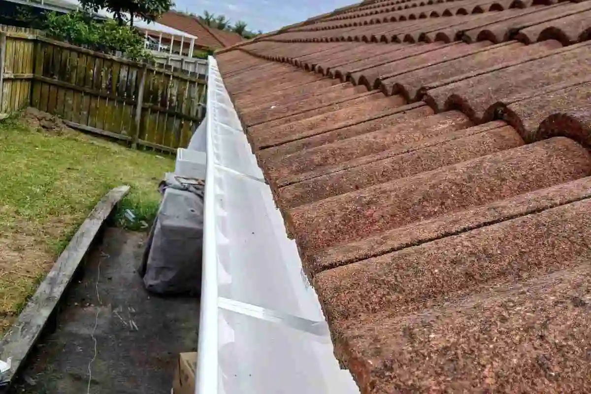 Checking gutters during heavy rain Auckland