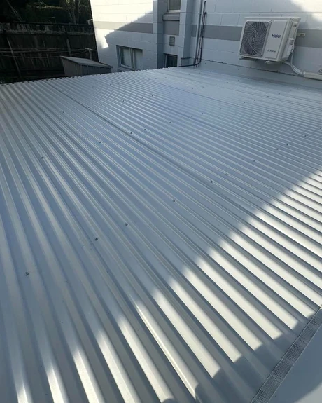 Old roof being removed during a house re-roofing project in Auckland